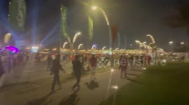 Tunisian fans arrive in the fan park in Doha.