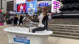 Faye Winter is body-painted as orca in bathtub to raise awareness of marine parks' cruelty