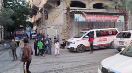 Palestinians checks the scene of fire that broke out in a building where residents attended a party in the Jabalia refugee camp in the northern Gaza strip