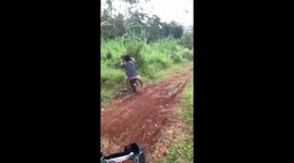 Motorbike fail! Unsuccessful start of race leaves man crashing into trees