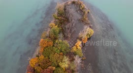 4k Drone Flyover small island with fall colors in the Detroit River