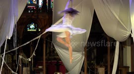 Aerial artist performs in church for Festival of Wonder, asking people to look up for hope