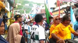 Convoy of fans carry World Cup country flags in soccer-mad town in Indonesia