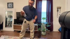 Man uses compressed air to pop water.   bottle like champagne