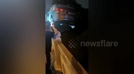 Furious driver uses forklift to dump car occupying his parking space into river