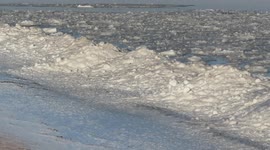 Piles of ice balls wash up on shore of Lake Superior in Wisconsin