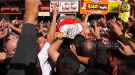 Mourners carry the body of Palestinian youth Mahmoud Al-Saadi, who was reportedly killed during a raid by Israeli forces in the West Bank city of Jenin