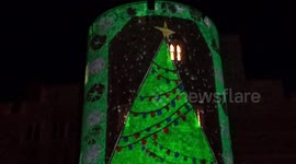 Christmassy light projections on Windsor Castle walls greet visitors in the town centre