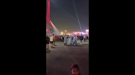 Argentinian fans celebrating at fan zone in Qatar for 2022 world cup wearing local dress