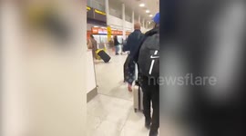 UK woman surprises husband with 26 of his friends and family at the airport for his 40th birthday
