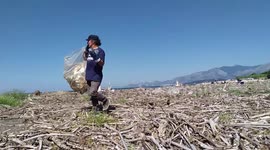 Volunteers of the Plastic Free association collect the waste brought by the flood of the river and the strong storms. Mouth of the Garigliano river which with its 38km length separates the Lazio region from the Campania region, making it also one of the m
