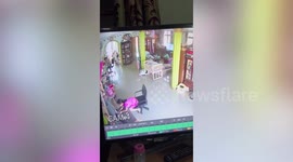 Bored youngster tumbles off swivel chair while playing