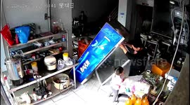 Chinese father saves daughter from being squashed by falling fridge