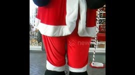 A gigantic, Santa Claus outside a toy shop in Naples