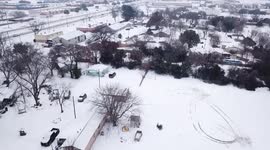 Drone captures amazing footage of snow and ice covering a small town