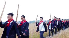 Pupils Walk Into A Paddy Field In Nantong, China