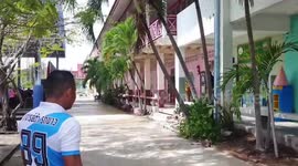 Thai policeman chases terrified kids with HANDGUN for school shooting training