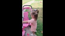 Toddler gets off her bike to greet and kiss a baby snake *PRECIOUS!*