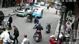 Chinese residents lift car up together to free boy trapped underneath