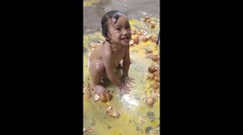 Boy makes a massive mess while playing with plethora of broken eggs