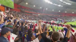Japan fans celebrate a great victory with a comeback win over the Germans