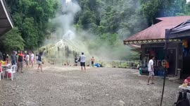 Tourists bathe in unusual steaming waterfalls in the Philippines
