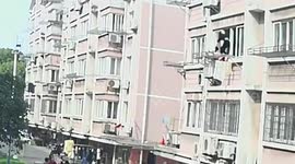 Mother and son rescue toddler who fell onto their balcony in China