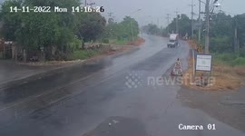 Pickup spins out of control across wet road before smashing into delivery truck in Thailand