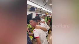 Brazil supporters celebrate in train following World Cup win against Serbia