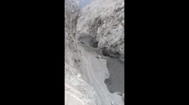 Spectators stand in awe as massive debris flow hits the village