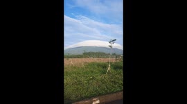 Strange cone-shaped cloud covers the top of mountain in Vietnam