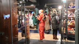 The Stop Shopping Choir get thrown out of the Disney store in Oxford Street after protesting by singing in the store on Black Friday