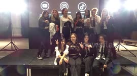 Korean team pose for pictures at the end of K - Pop AZULE dance event at the V&A Friday Late: Making Waves
