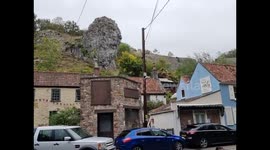 A huge rock that looks like lion head, right next to tea shop called lion head in Cheddar