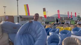 English fan cleaning up at the fan village in Zafaran after shielding from the blistering heat.