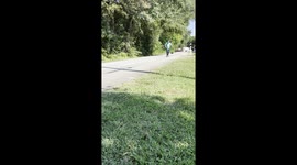 Trimming grass on a skateboard.  Two activities added together equal fun!