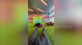 Fans and airline staff watch World Cup games at Qatar airport