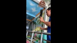 The man used a knife to cut the coconut shell quickly