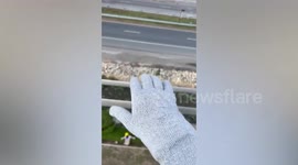 Lineworker shows electricity current flowing from cable to gloves during safety training