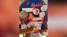 Student makes awesome Taylor Swift portrait using 'hole punch art'