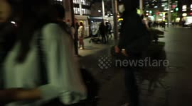 CCP supporter argues with protesters at vigil held for Urumqi fire victims