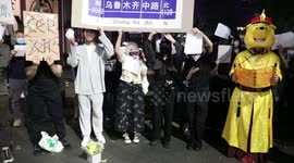 Protester dressed as Winnie the Pooh attends vigil for victims of Urumqi fire in China