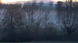 Pretty scene as fog and mist rolls over English countryside near Stratford upon Avon
