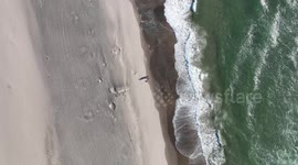 Aerial View Of Waves Crashing Into A Beach On The Oregon Coast