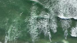 Aerial View Of Waves Crashing Into A Beach On The Oregon Coast