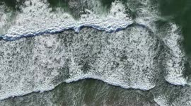 Aerial View Of Waves Crashing Into A Beach On The Oregon Coast