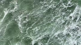 Aerial View Of Waves Crashing Into A Beach On The Oregon Coast