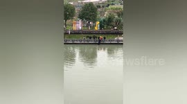 Brave Chinese man dives into river to rescue drowning woman