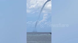 Boat flees from enormous waterspout tornado in the Philippines