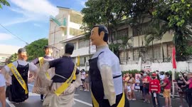 Lively giant mascot falls flat on face during parade in the Philippines